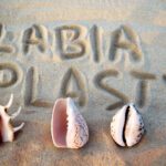 labiaplasty written on sand