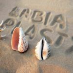 Labiaplasty written over Sand