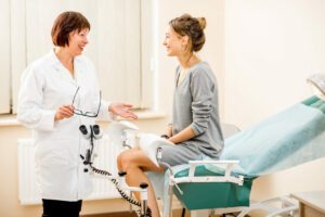 Young woman patient with gynecologist in the office