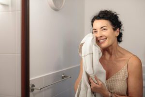 Menopausal woman smiling after a shower